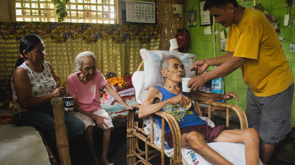 Johnny and Juanita Paz, a couple who takes care of two sick, elderly family members in Datu Abdullah Sangki, Maguindanao. (Photo: Princess Taroza/Oxfam)