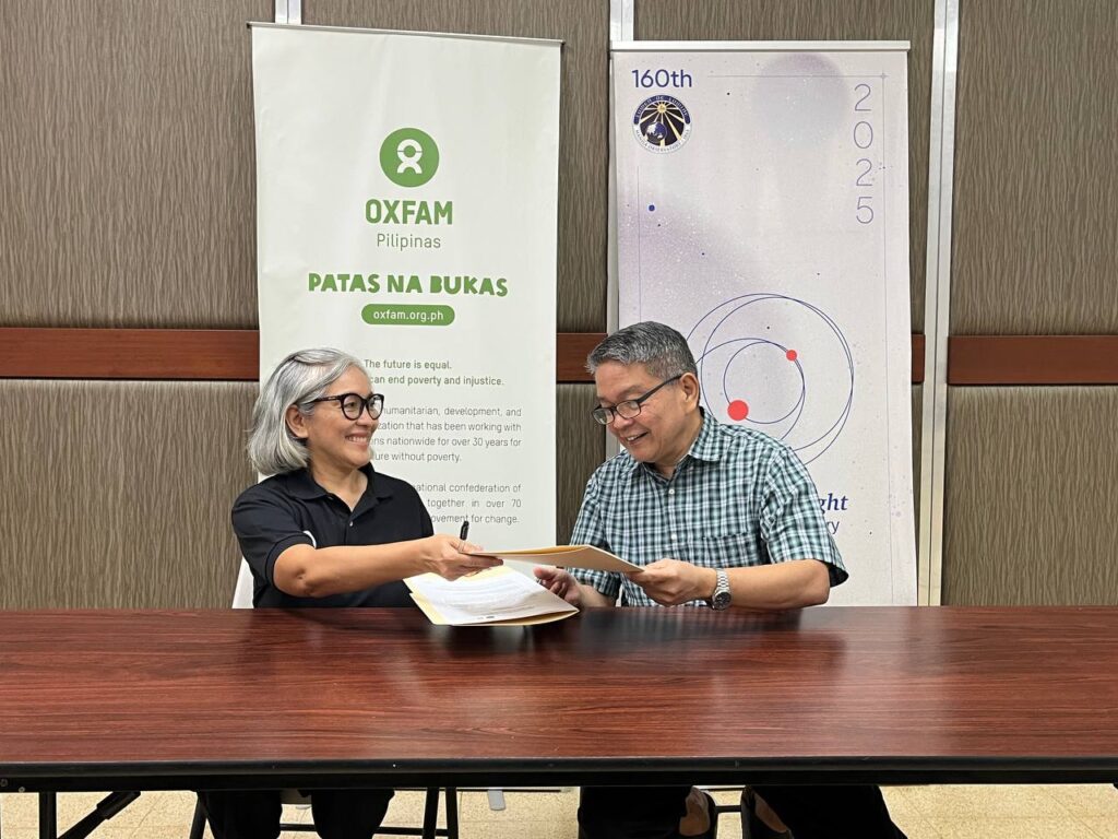 Photo of Oxfam Pilipinas Executive Director Lot Felizco and Manila Observatory Executive Director Fr. Jose Ramon T. Villarin, S.J., renewing the Memorandum of Understanding for enhancing the multi-hazard index to determine the thresholds and triggers for launching an anticipatory action. Anticipatory action refers to proactive measures that reduce the adverse impact of a forecasted disaster. It is the defining concept of Republic Act 12287, or the "Declaration of State of Imminent Disaster Act." Oxfam Pilipinas and Manila Observatory collaborated under the SUPREME BARMM project in 2023 to improve the early warning system and anticipatory action in the Bangsamoro region.