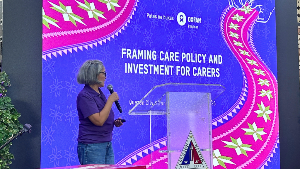 Photo of Lot Felizco of Oxfam Pilipinas speaking at the Quezon City (QC) Local Government Unit at the Transformative Care Policy and Practice Conference, organized by the QC Gender and Development Office in partnership with UN Women, on 12 March 2026. For more info on care work, care work pioneer Oxfam Pilipinas, care programming, care work policy advocacy, and care work policy champions, visit oxfam.org.ph