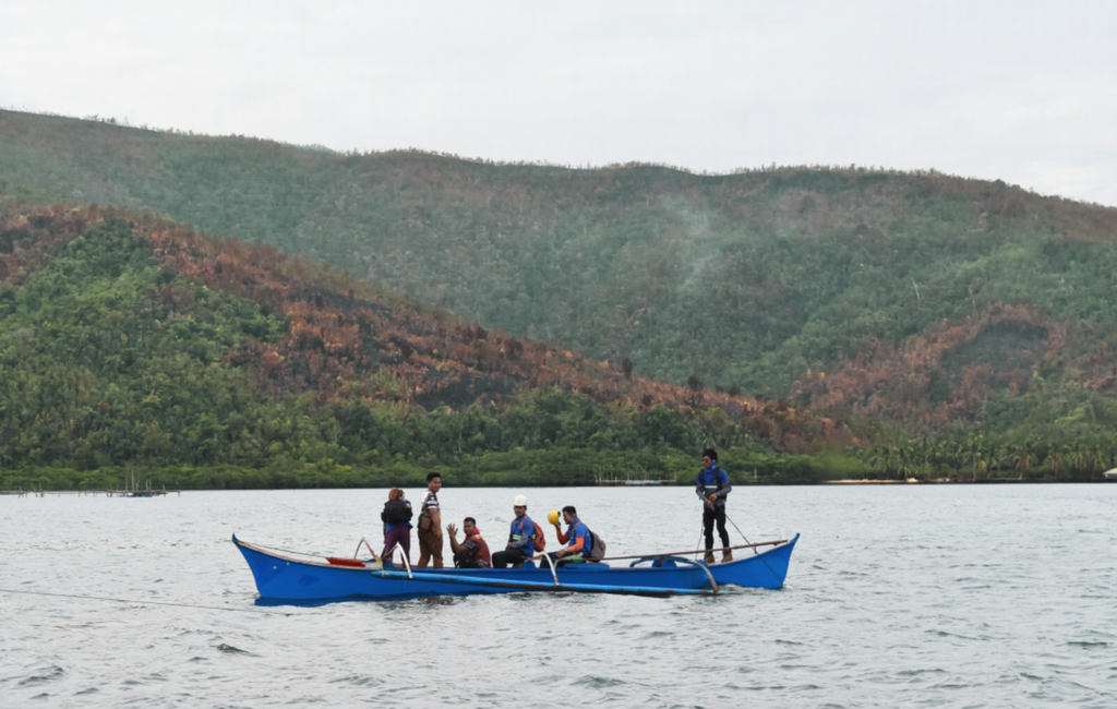 Mining workers crossing the bay to the mining operations site in Dinagat Islands, Philippines Anaya Escote/ Bantay Kita